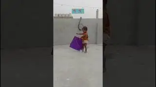 #baby trying to fly kite#patang#baby wala video #kiteflying #kites #kite lover#roof#cutebaby #funny