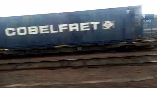 2C34 320302 Dalmuir-Cumbernauld passing Mossend freight terminal 1/9/23