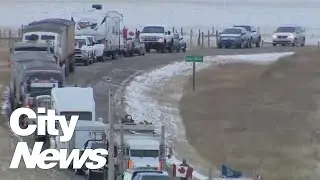 Truckers stranded on both sides of border as protestors block Coutts border crossing