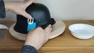 Applying a SS decal to a WW2 german helmet shell