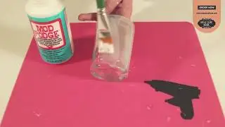 Mod Podge acts as a glue and sealer. You can use it to glue decoupage napkin or other paper to solid
