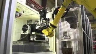 Automation Solutions: Fanuc R2000 iB robot is mounted to an RTU to service 3 VMC's