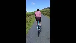 Cycling up a big hill in the Pennines The Cross of Greet climb