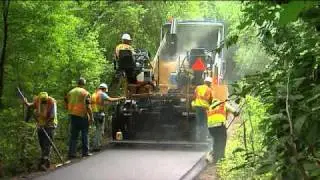 Cat&reg; AP555E Mobil-trac&trade; Asphalt Paver in Action