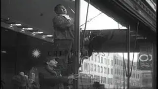 Workers repair broken shops and rioters captured by police during Harlem riots in...HD Stock Footage