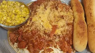 Cowboy spaghetti/ salad/garlic bread/sweet corn/swirl cake/soda