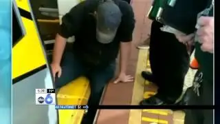 Caught on Camera: Crowd Moves Train to Help Trapped Passenger
