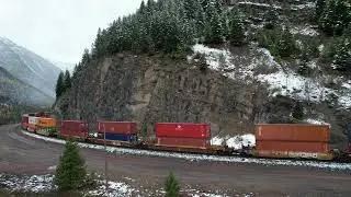 Eastbound Stack train climbs the west face of Marias Pass MT.