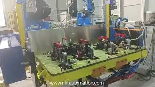 Our three axis positioner with two robots standing on the middle.
