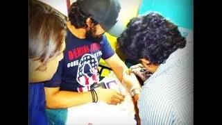 Mikki Koomar got  guitar's tattoo on his  left fore arms
