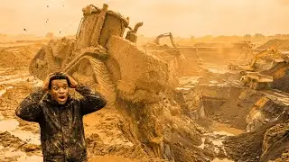A tractor stuck in mud is undergoing a thorough cleaning process.