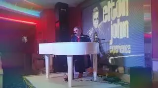 Greg Andrew as Elton John