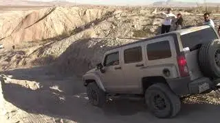 Hummer H3 , Anza Borrego, Diablo Drop. Hummer 4X4  dropping down with  the Squaredrop Trailer in tow