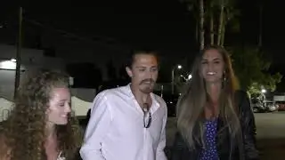 Joe Anglim with Sierra Dawn Thomas talks about wild animals outside the Survivor Cast wrap party at