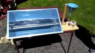 Solar water purification with a parabolic trough reflector.