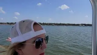 Local Property Broker Hollie MacKellar tours point clear by boat.