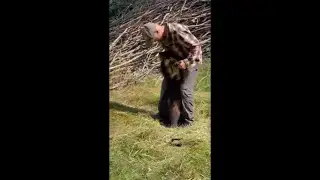 Guy Kissing a Little Wolverine Then Carries It Like a Baby