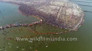 Stunning aerial view of Triveni Sangam : Pilgrims at 'shahi snan' on Mauni Amavasya at Kumbh Mela