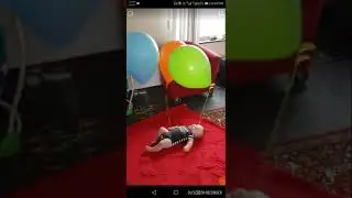 Cute baby playing with balloons