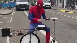 Spiderman plays drums