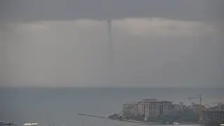 Waterspout touches down off the Port in Miami, Florida