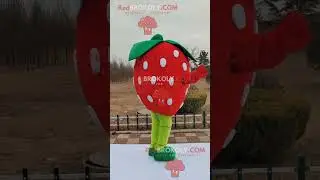Strawberry man REDBROKOLY mascot with green pants and shoes red gloves and a happy face