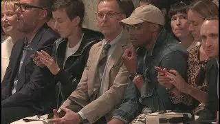 Whoopi Goldberg and Russell Westbrook front row of Thom Browne Fashion Show