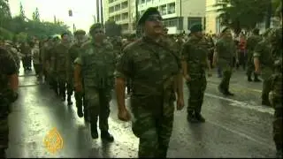 Protests greet Merkel in Greece