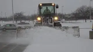 Arctic Sectional Sno-Pusher Clearing Parking Lot