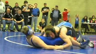 185 lb. wrestler takes down his opponent from danville at districts