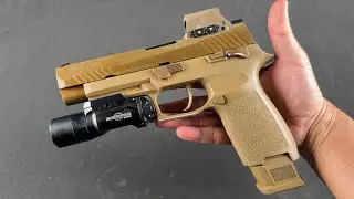 The SIG SAUER M17, a loaned weapon for the US Army, features a striker-fired system and is a mode...
