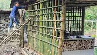 A day in the kitchen in a rustic bamboo kitchen - a wisp of smoke from the stove