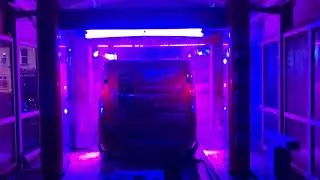 Watch a red van getting washed at the Main Street Car Wash in Larne