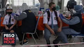 China's vaccine faces scrutiny as Indonesians die despite shots, U.S. pledges donations