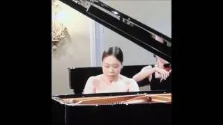 Naked girl plays Mozart on the piano