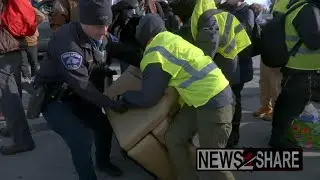Police attempt to break up activist 