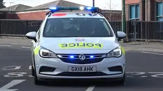 Surrey Police, Marked Vauxhall Astra, Driver Training Unit (DTU), on a blue light run in Guildford.