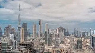 Panoramic skyline of Dubai with business bay and downtown district timelapse.