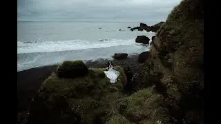 Vows exchange on a black sand beach with family members