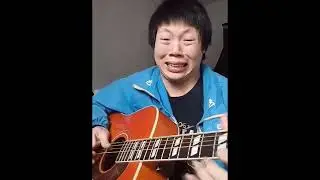 chinese kid playing guitar until something comes out
