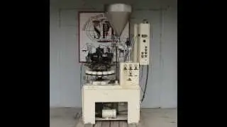 MRM Elgin model E 16 station rotary tube filler and sealer