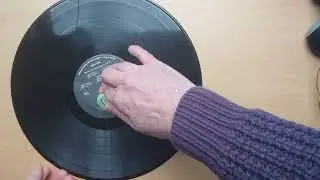 Good idea to fold a long play record to reduce postage costs?