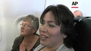 Couple wed on flight on day NZealand legally recognises same-sex marriage