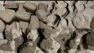 Crunchy soft floor crumbling of sand cement and coal ashes dry and pouring paste on rectangle shapes