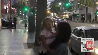 Madison Beer greets a young fan outside Katsuya Restaurant