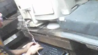 Arnel playing flute over PC