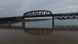DJI FPV DRONE cruising low on the river ,trains and low bridges