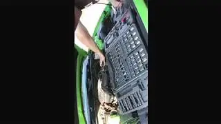 Asa helps son put on cold air intake his son purchased for his car.
