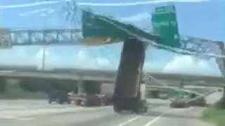 Truck smashes into overhead highway sign despite warnings