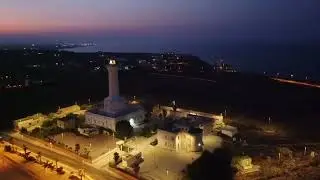 faro di cozzo Spadaro ed il castello tafuri al tramonto in porto palo di capo passero
